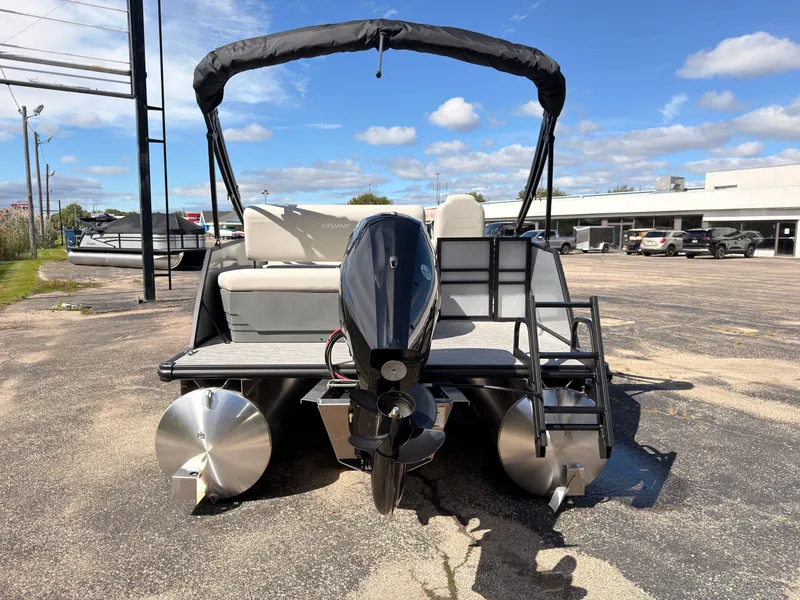 Slide: The Image of The image shows a 2027 Sylvan Mirage 820 CLZ DH pontoon boat with an outboard motor. - 5