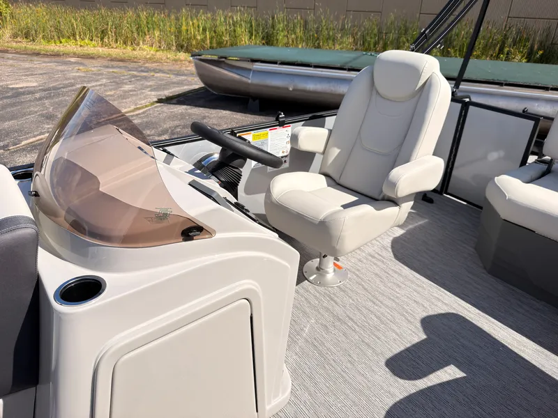 Slide: The Image of The image shows the helm of a 2027 Sylvan Mirage 820 CLZ DH with a comfortable captain's chair. - 30
