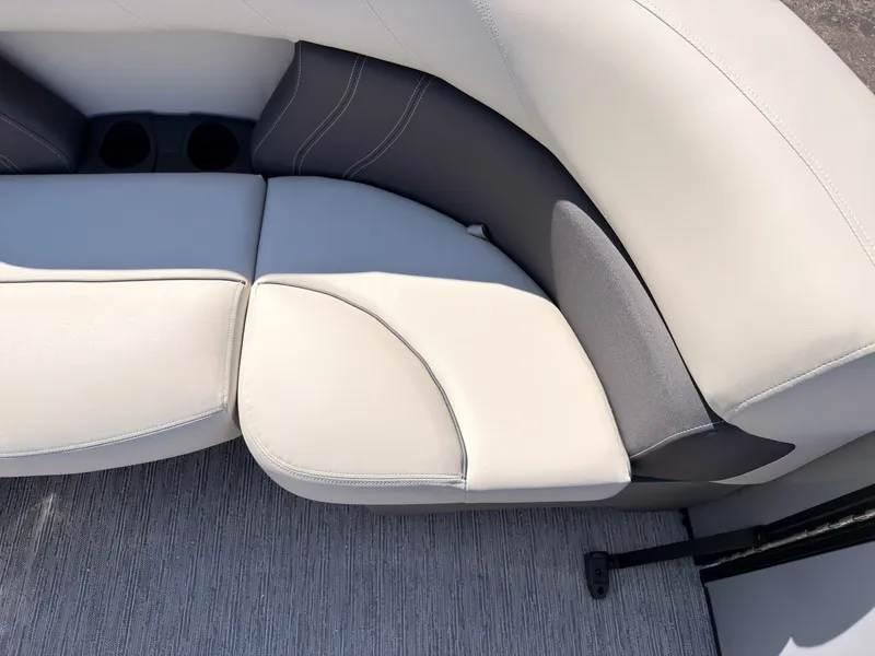 Slide: The Image of Close-up of a sleek, cushioned seating area with gray and white upholstery on a boat. - 18