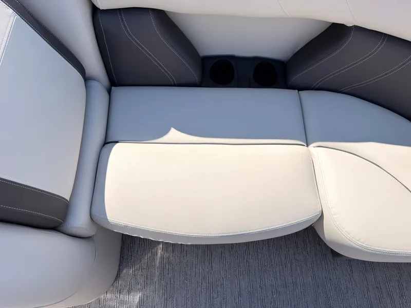 Slide: The Image of The image shows a luxurious cream-colored boat seat with gray accents and built-in cup holders. - 20