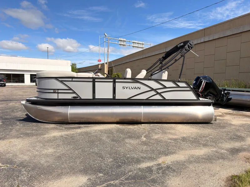 Slide: The Image of A 2027 Sylvan Mirage 820 CLZ DH pontoon boat is parked on a lot. It features a modern design. - 7