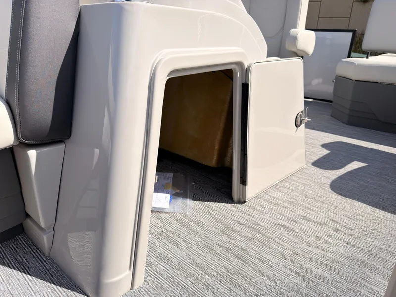 Slide: The Image of An open storage compartment on a 2027 Sylvan Mirage 820 CLZ DH boat. - 25