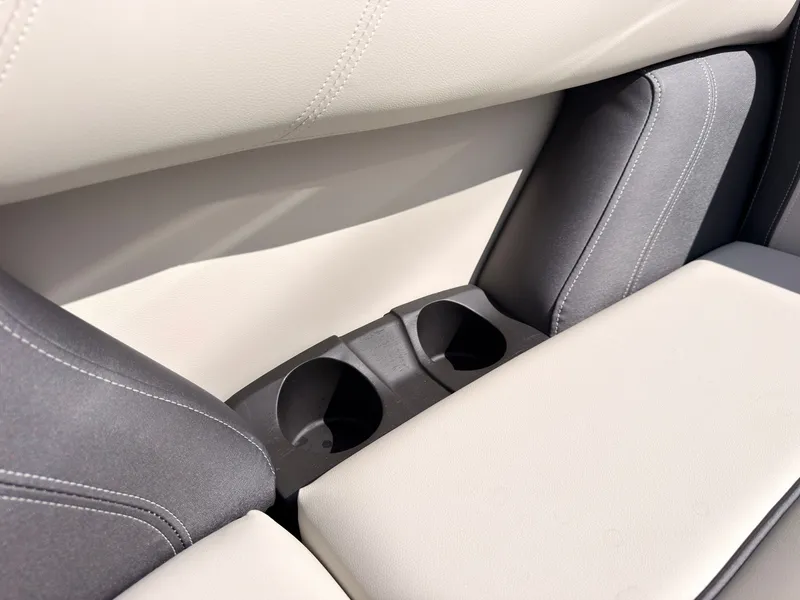 Slide: The Image of Close-up of a boat seat with two built-in cup holders. - 16