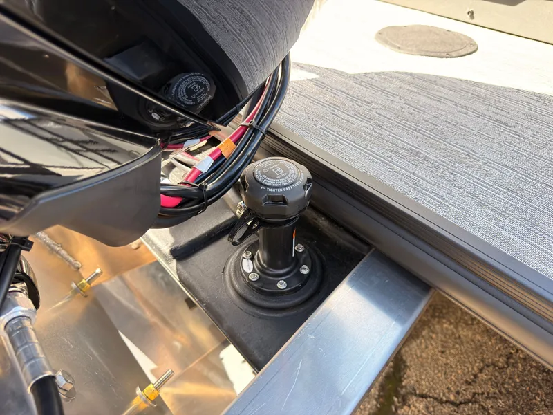 Slide: The Image of Close-up of a boat deck detail with cables and a round cover. - 48