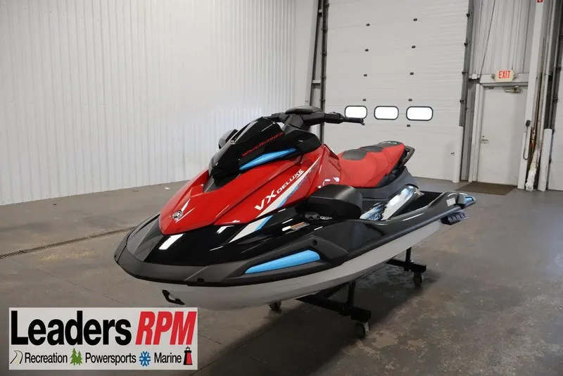 The Image of 2026 Yamaha WaveRunner VX Deluxe in showroom, red and black design, Leaders RPM logo visible. - 2