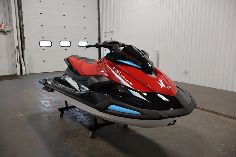 Slide: The Image of 2026 Yamaha WaveRunner VX Deluxe in a showroom, featuring sleek red and black design. - 3