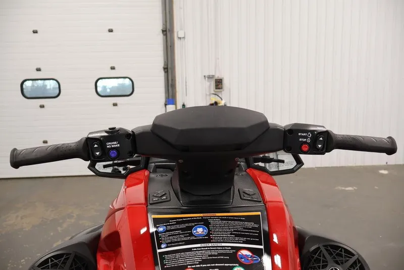 Slide: The Image of 2026 Yamaha WaveRunner VX Deluxe handlebars and controls in a garage setting. - 12