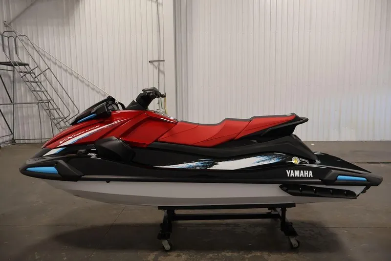 Slide: The Image of 2026 Yamaha WaveRunner VX Deluxe in red and black, displayed indoors on a stand. - 23