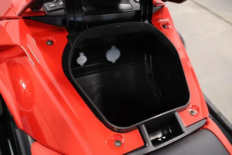 Slide: The Image of 2026 Yamaha WaveRunner VX Deluxe storage compartment, open and empty, in vibrant red color. - 14