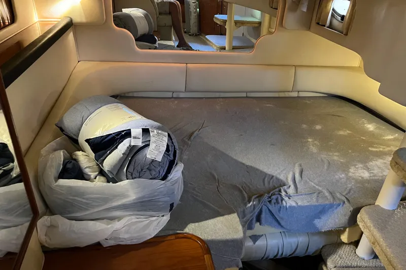 Slide: The Image of Interior cabin of a 2001 Sea Ray 340 Sundancer with bedding and cozy seating. - 26