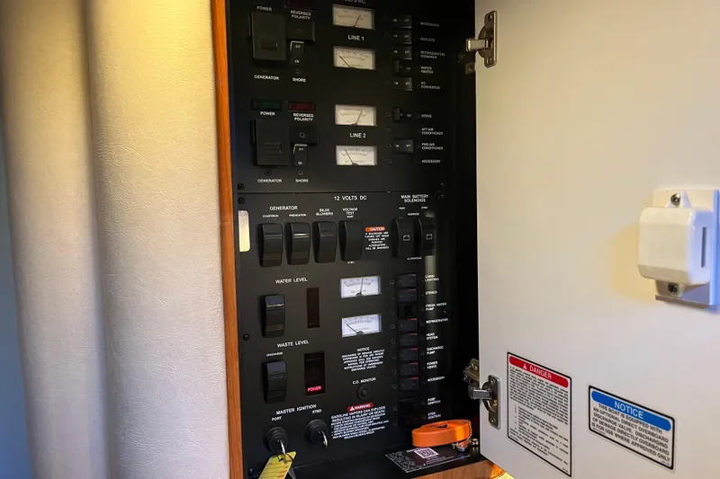 Slide: The Image of Electrical control panel inside a 2001 Sea Ray 340 Sundancer boat. - 19