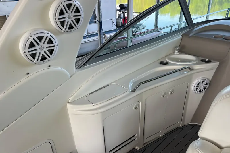 Slide: The Image of Interior of a 2001 Sea Ray 340 Sundancer boat with speakers and sink. - 8