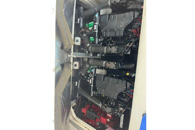Slide: The Image of Engine compartment of a 2001 Sea Ray 340 Sundancer, showcasing dual engines and mechanical components. - 30