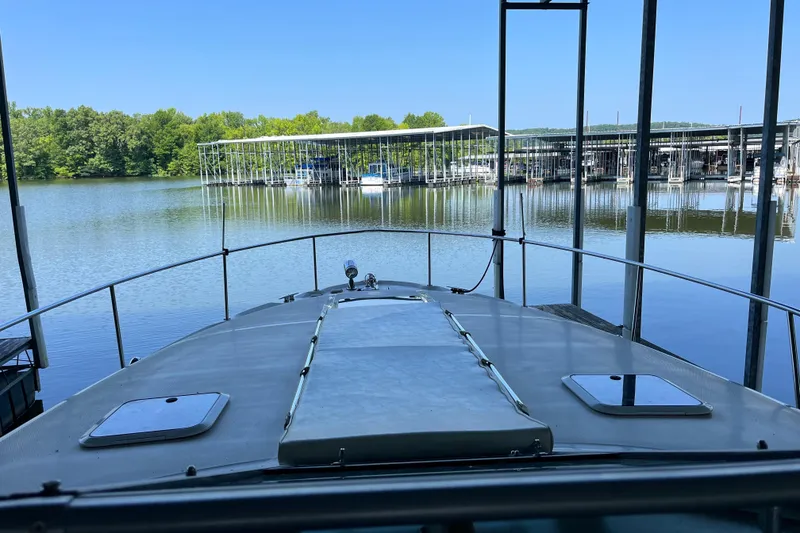 Slide: The Image of Bow view of 2001 Sea Ray 340 Sundancer docked at a serene marina. - 38