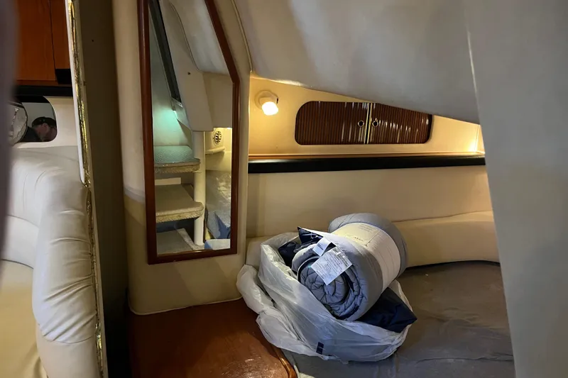Slide: The Image of Interior of 2001 Sea Ray 340 Sundancer with bedding and mirror. - 27