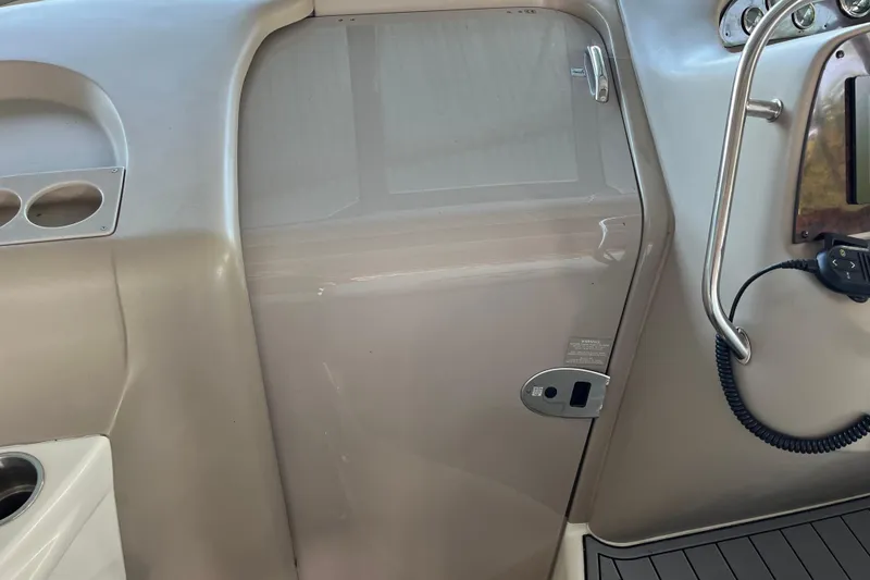 Slide: The Image of 2001 Sea Ray 340 Sundancer cabin door with sleek interior design and control panel. - 16