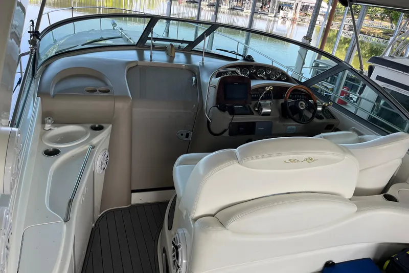 Slide: The Image of Cockpit of 2001 Sea Ray 340 Sundancer with steering wheel and control panel. - 7