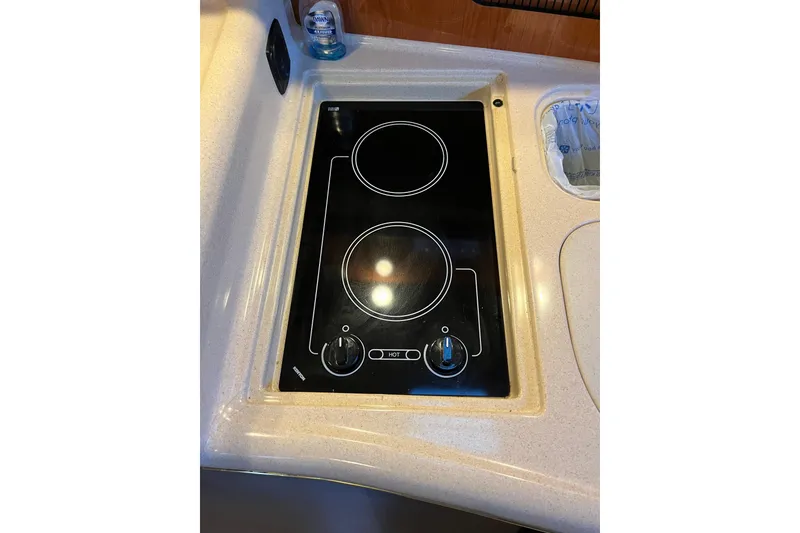 Slide: The Image of Built-in stovetop on 2001 Sea Ray 340 Sundancer yacht kitchen counter. - 21