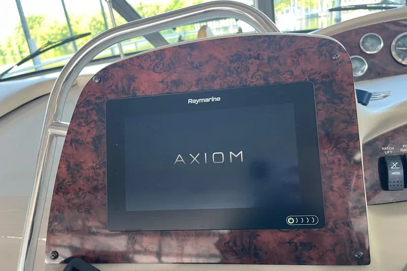 Slide: The Image of Raymarine Axiom display on 2001 Sea Ray 340 Sundancer boat dashboard. - 15