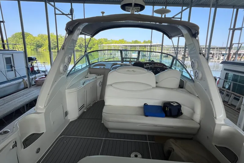 Slide: The Image of Interior view of a 2001 Sea Ray 340 Sundancer yacht docked at a marina. - 5