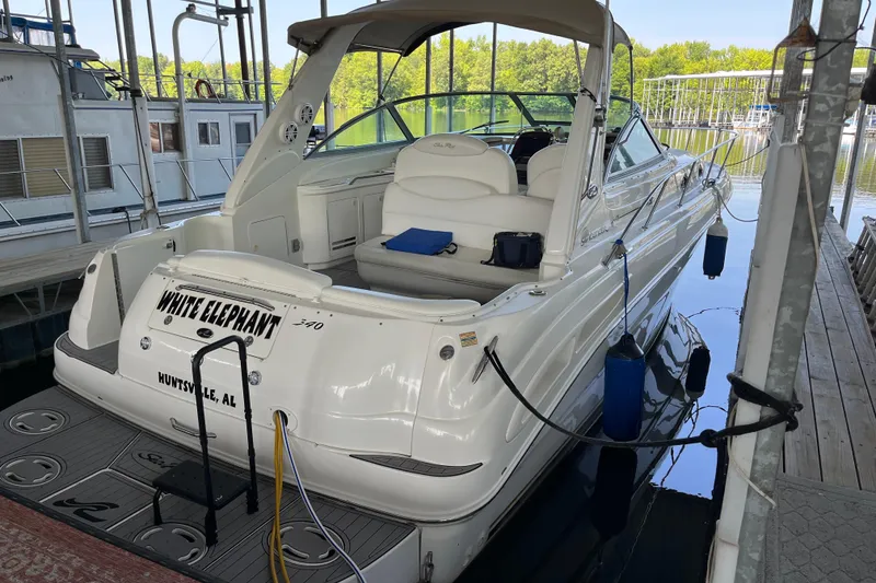 Slide: The Image of 2001 Sea Ray 340 Sundancer docked, featuring spacious seating and sleek design. - 3