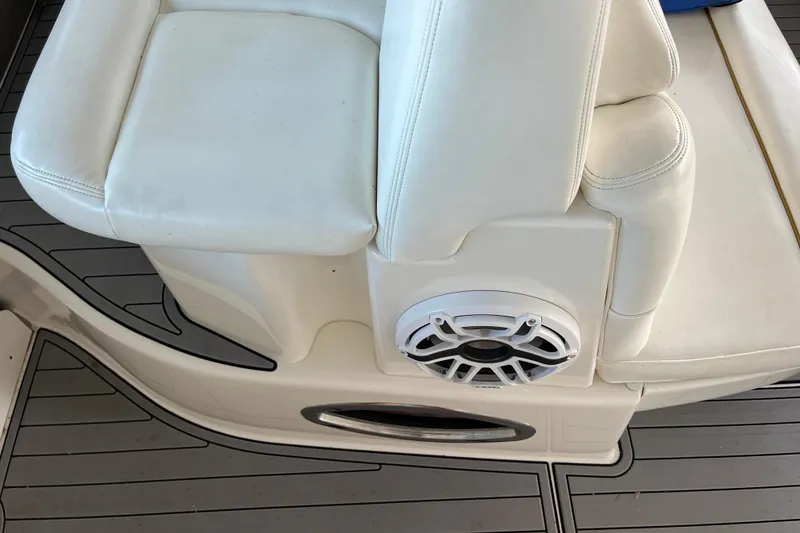Slide: The Image of White leather seating with speaker on 2001 Sea Ray 340 Sundancer boat deck. - 10