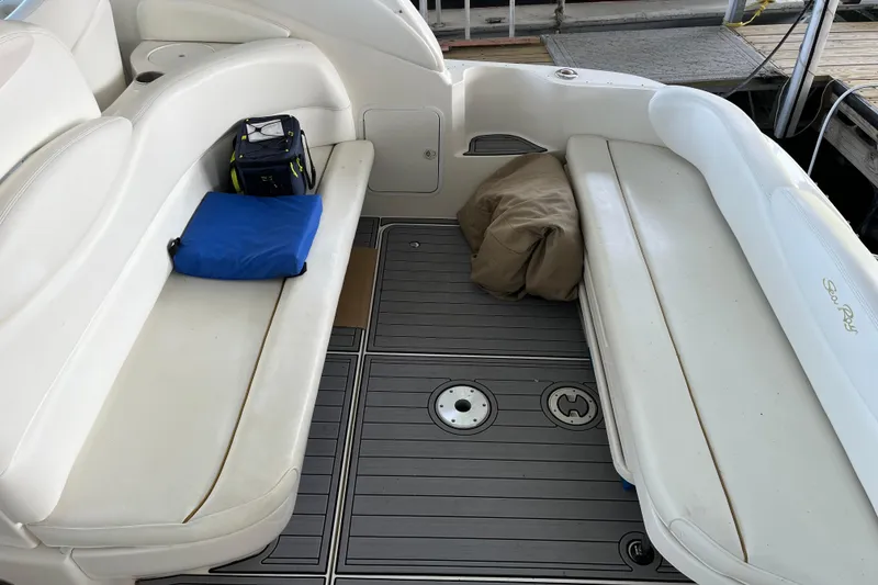 Slide: The Image of 2001 Sea Ray 340 Sundancer boat interior with white seating and accessories. - 6