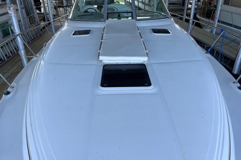 Slide: The Image of 2001 Sea Ray 340 Sundancer boat deck with sunpad and hatches. - 39