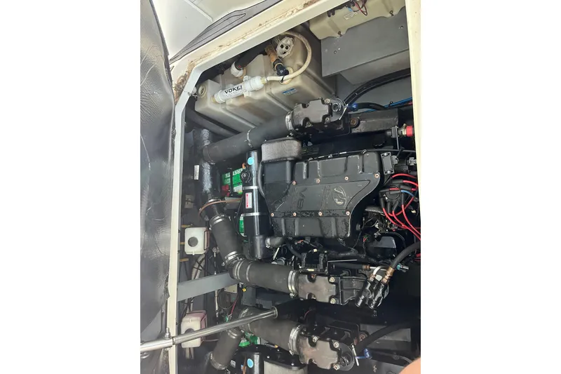 Slide: The Image of Engine compartment of a 2001 Sea Ray 340 Sundancer boat, showcasing mechanical components. - 31