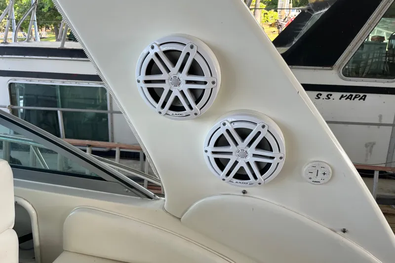 Slide: The Image of Speakers on a 2001 Sea Ray 340 Sundancer boat, featuring JL Audio and Fusion controls. - 9