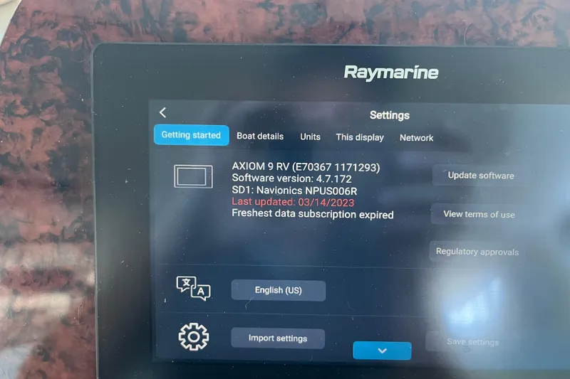 Slide: The Image of Raymarine display on 2001 Sea Ray 340 Sundancer showing software settings and update options. - 32