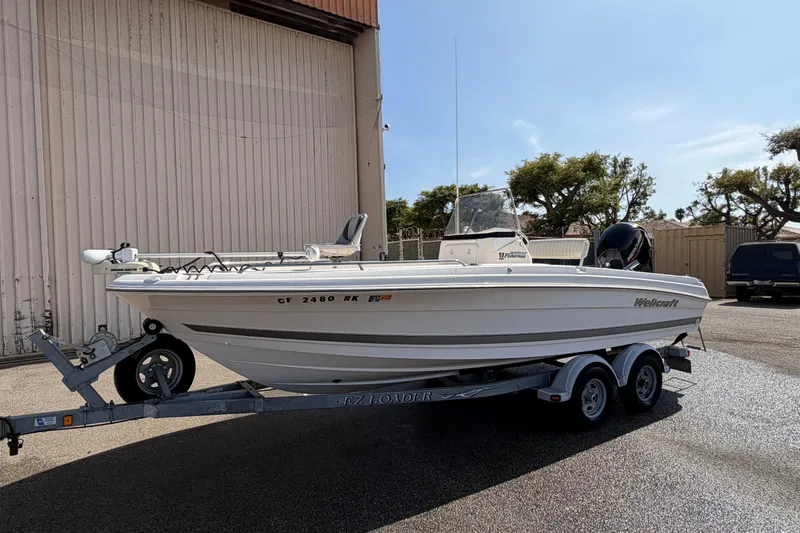 Slide: The Image of 2005 Wellcraft 200 LT Fisherman boat on trailer, parked outdoors. - 3