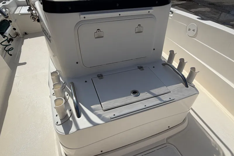 Slide: The Image of 2005 Wellcraft 200 LT Fisherman boat interior with rod holders and storage compartment. - 5