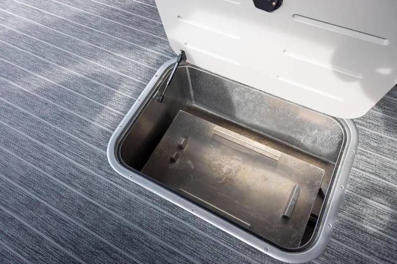 Slide: The Image of Open storage compartment on 2026 Premier 270 Intrigue GTS RF - CL boat with port gate. - 16