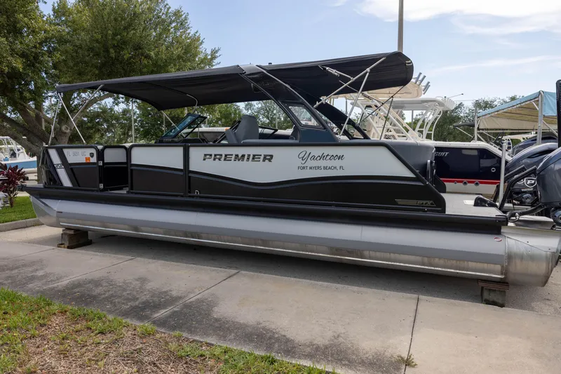 The Image of 2026 Premier 270 Intrigue GTS RF pontoon boat with port gate, docked in Fort Myers Beach. - 0
