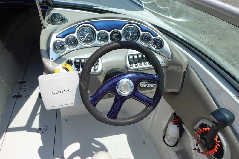 Slide: The Image of Dashboard of a 2004 Crownline 240 EX boat with Garmin navigation system. - 4