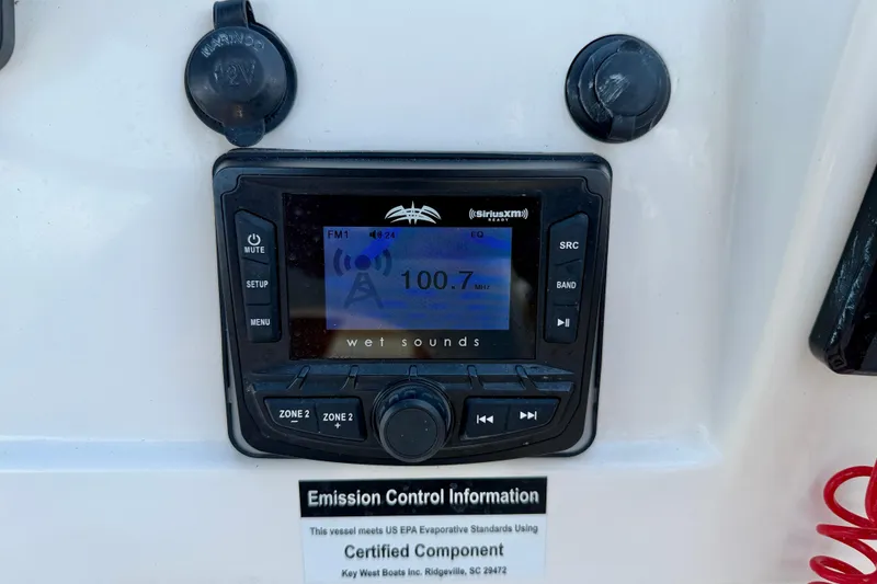 Slide: The Image of Key West 203 DFS 2016 boat stereo system displaying FM 100.7, with emission control information. - 20