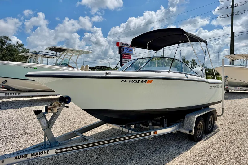 Slide: The Image of 2016 Key West 203 DFS boat on trailer under a cloudy sky. - 1