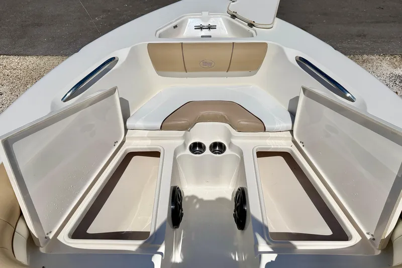 Slide: The Image of Interior view of a 2016 Key West 203 DFS boat, featuring open storage compartments. - 27