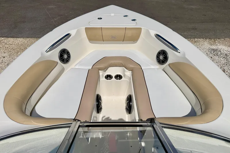 Slide: The Image of 2016 Key West 203 DFS boat interior with beige seating and built-in speakers. - 10