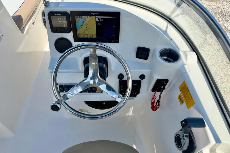 Slide: The Image of Steering console of a 2016 Key West 203 DFS boat with navigation display. - 17