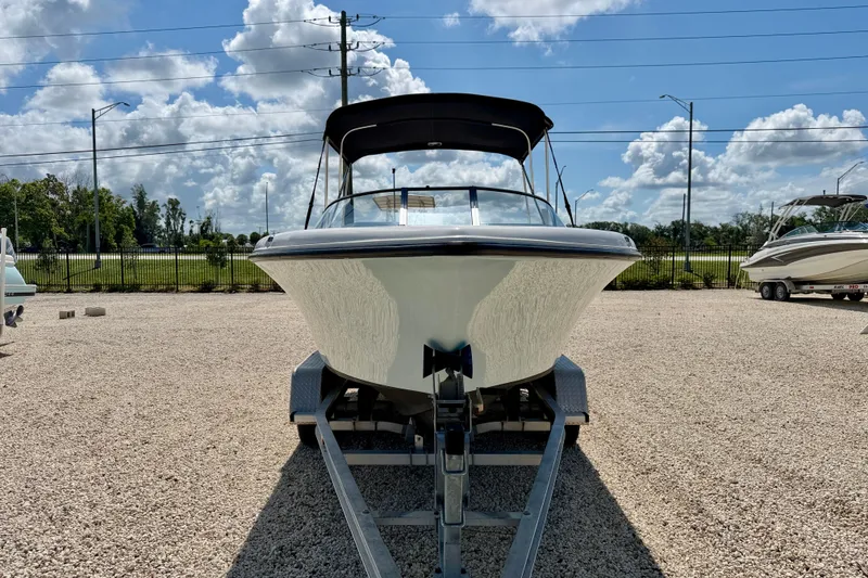 Slide: The Image of 2016 Key West 203 DFS boat on trailer under blue sky. - 2