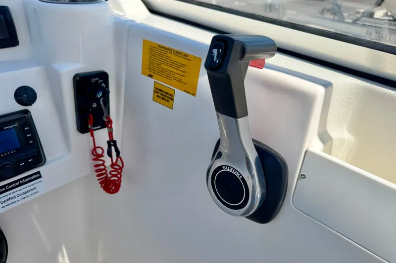 Slide: The Image of Control panel of a 2016 Key West 203 DFS boat with Suzuki throttle. - 22
