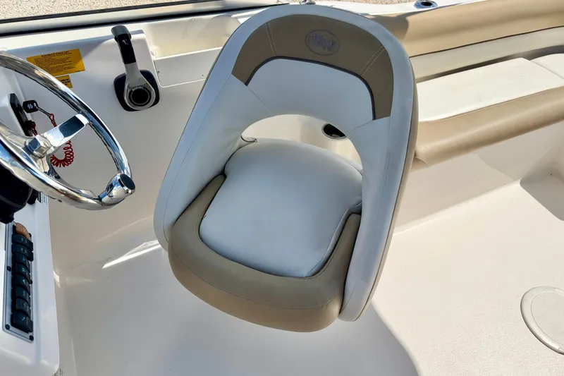 Slide: The Image of Captain's seat and steering wheel of 2016 Key West 203 DFS boat interior. - 14