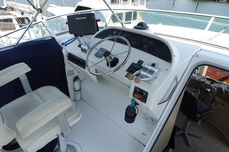 Slide: The Image of Cockpit of 2000 Bayliner 4788 Pilot House Motoryacht with steering wheel and controls. - 9