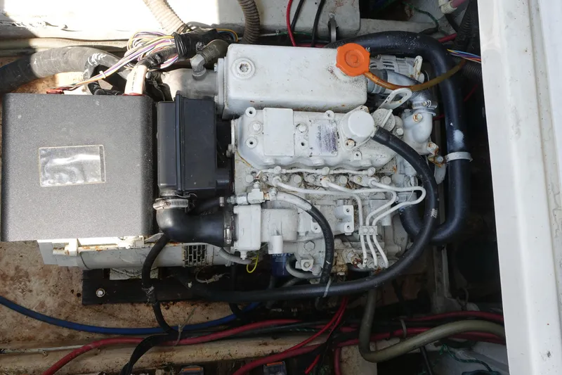 Slide: The Image of Engine compartment of a 2000 Bayliner 4788 Pilot House Motoryacht, showcasing mechanical components. - 35