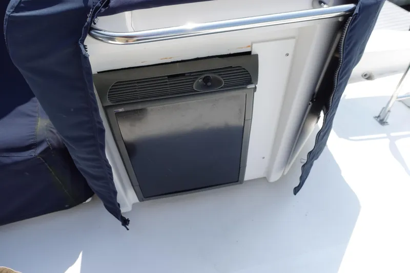 Slide: The Image of Bayliner 4788 Pilot House Motoryacht 2000, onboard mini fridge with protective cover. - 13