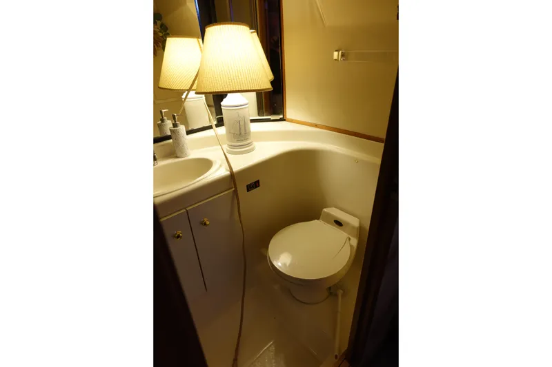 Slide: The Image of Bathroom interior of 2000 Bayliner 4788 Pilot House Motoryacht with lamp and sink. - 21