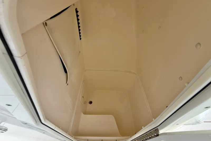 Slide: The Image of Storage compartment inside 2020 Cobia 237 Center Console boat, featuring spacious interior design. - 33