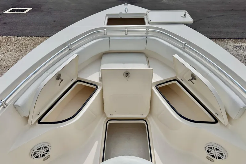 Slide: The Image of 2020 Cobia 237 Center Console boat interior with open storage compartments. - 11